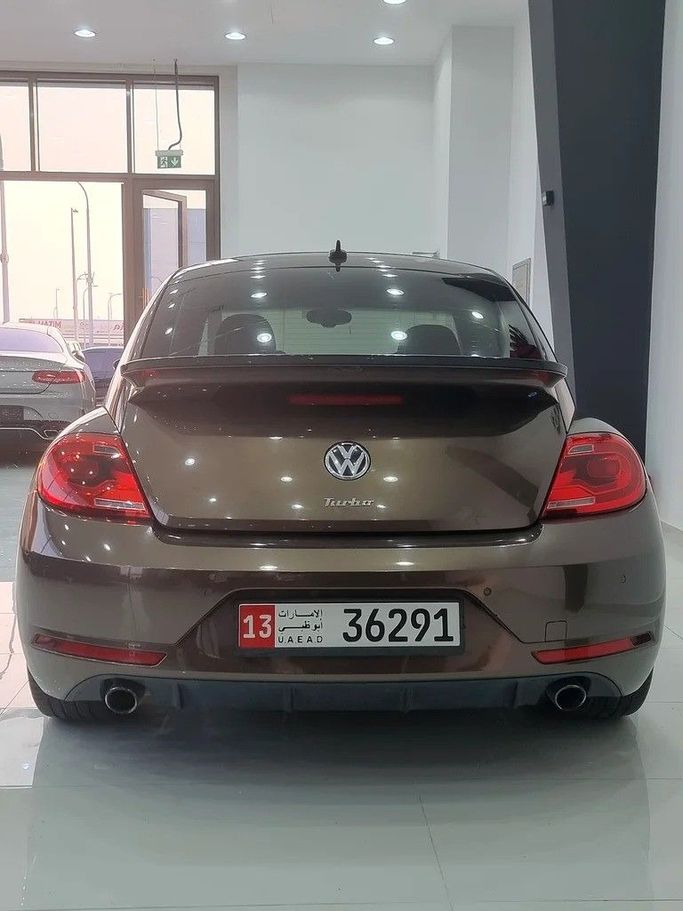 Used Volkswagen Beetle II (A5), 2.0 l, 2016 in Dubai by F1 Motors, Brown color. GCC Specs | AUTO.AE
