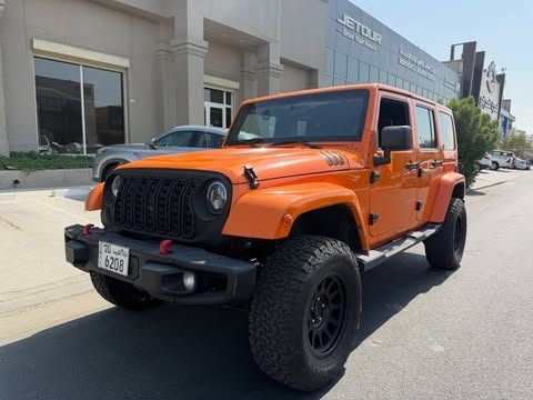 مستعملة ⁦Jeep Wrangler III (JK)، 3.6 l، 2012⁩ في في الكويت, الفروانية من MARBEYA MOTORS، اللون برتقالي.  | AUTO.AE | إعلان #286989