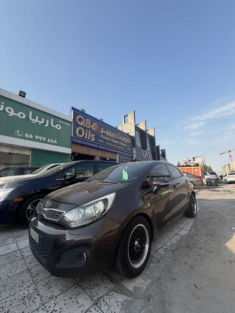 Used ⁦Kia Rio III, 1.6 l, 2014⁩ in Kuwait, Al Farwānīyah by MARBEYA MOTORS, Brown color.  | AUTO.AE | Listing #287330
