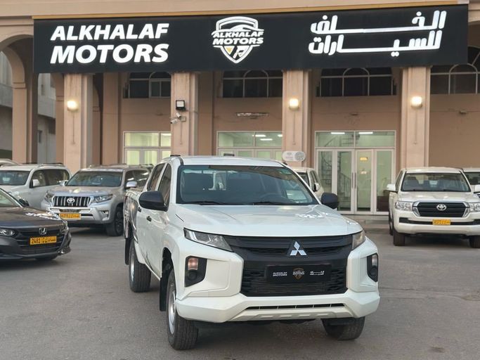 Подержанный Mitsubishi L200 V Рестайлинг, 2.4 л, 2022 в Оман, Маскат от ALKHALAF MOTORS Белый цвет. GCC | AUTO.AE | Объявление #252491