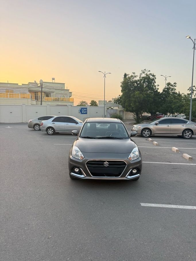 Подержанный Suzuki DZire III Рестайлинг, 1.2 л, 2023 в Оман, Маскат от AL MOUJ CARS Коричневый цвет. GCC | AUTO.AE | Объявление #252194
