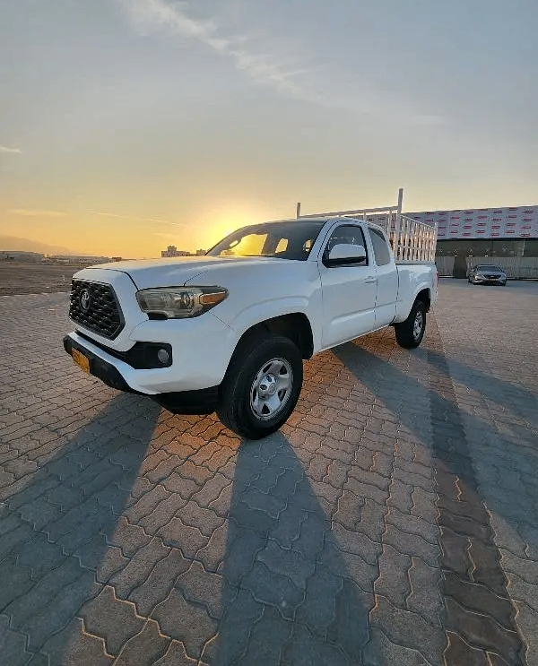 Used Toyota Tacoma III, 3.5 l, 2018 in Oman, Muscat by Al Dhabi Motors, White color. American Specs | AUTO.AE