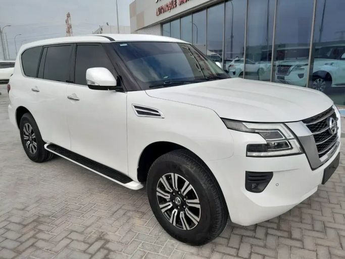 Подержанный Nissan Patrol VI (Y62) Рестайлинг 2, 5.6 л, 2021 в Рас-эль-Хайме от Al Jamal Automobile Showroom Белый цвет. GCC | AUTO.AE