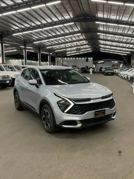 Used Kia Sportage V, 2.0 l, 2023 in Saudi Arabia, Medina by Jalawi Zaben Al Alawi معرض جلوي زابن العلوي للسيارات, Silver color.  | AUTO.AE | Listing #268486