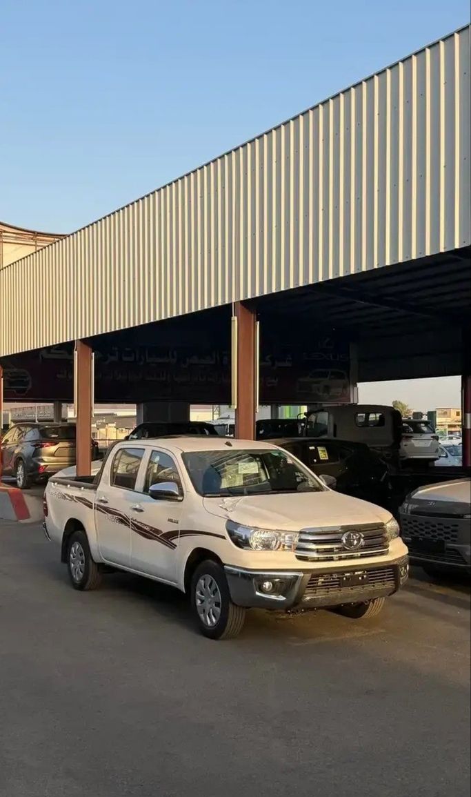 Новый Toyota Hilux VIII, 2.4 л, 2026 в Саудовская Аравия, Медина от Zahrat Al Eis شركة زهرة العيص للسيارات Белый цвет. GCC | AUTO.AE | Объявление #268035