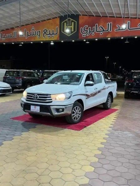 Новый Toyota Hilux VIII Рестайлинг 2, 2.7 л, 2026 в Саудовская Аравия, Медина от Hamed Al Jabri Cars مؤسسة حامد الجابري للسيارت Белый цвет.  | AUTO.AE | Объявление #268614