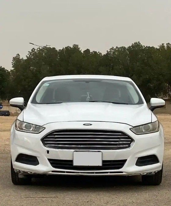 Подержанный Ford Fusion (North America) II, 2.5 л, 2014 в Саудовская Аравия, Эр-Рияд от Bayraq Al Ibda’a Cars معرض بيرق الابداع Белый цвет.  | AUTO.AE | Объявление #261495