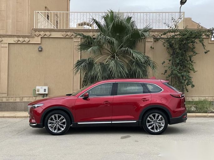 Used Mazda CX-9 II Facelift, 2.5 l, 2020 in Saudi Arabia, Riyadh by Sharyan Al Asimah معرض شريان العاصمة للسيارات, Red color.  | AUTO.AE | Listing #263464