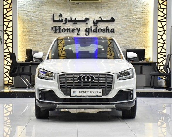 Подержанный Audi Q2 L e-tron I, 2021 в Шардже от Honey Gidosha Used Cars Tr. Белый цвет.  | AUTO.AE