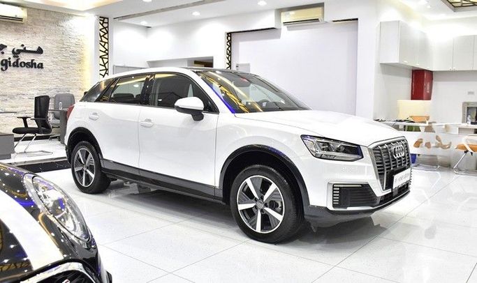 Подержанный Audi Q2 L e-tron I, 2021 в Шардже от Honey Gidosha Used Cars Tr. Белый цвет.  | AUTO.AE