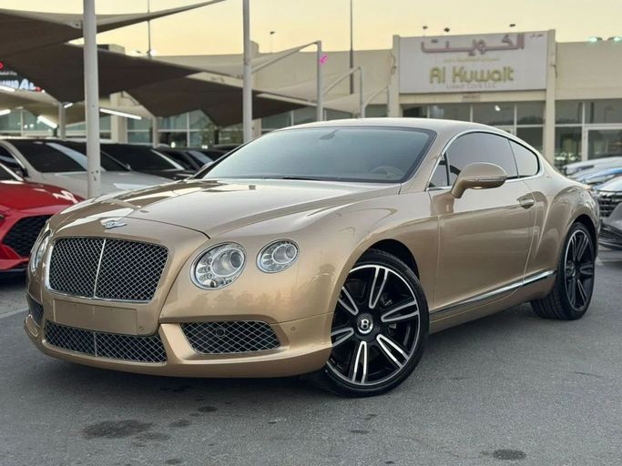 Подержанный Bentley Continental GT II, 4.0 л, 2013 в Шардже от Nour Alnukhba Motors Золотистый цвет. GCC | AUTO.AE
