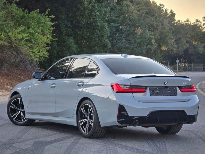 Подержанный BMW 3 Series 320i VII (G2x) Рестайлинг 2, 2.0 л, 2024 в Шардже от Al Jana Used Cars Серый цвет. Корейская | AUTO.AE