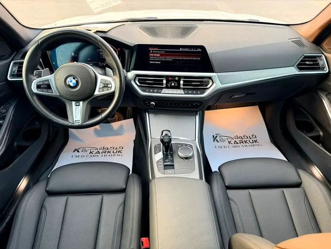 Подержанный BMW 3 Series 330i xDrive VII (G2x), 2.0 л, 2021 в Шардже от Karkuk Used Cars Белый цвет. Канадская | AUTO.AE