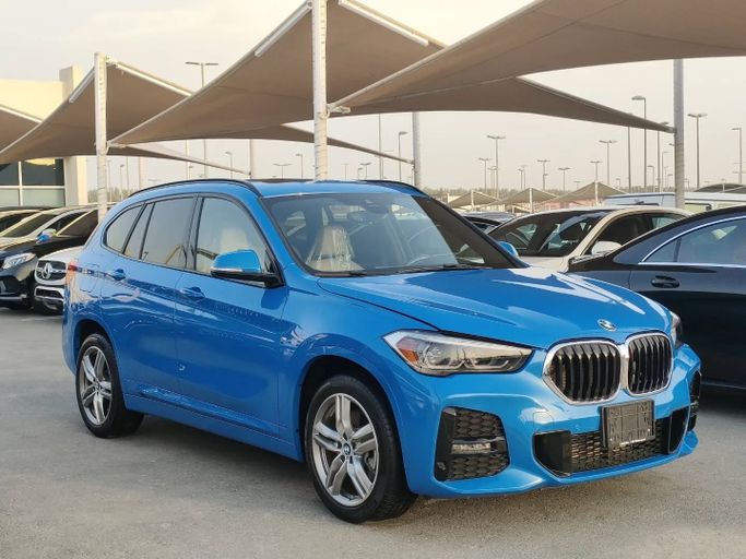 Used BMW X1 28i xDrive II (F48) Facelift, 2.0 l, 2020 in Sharjah by Al Nukhba Al Malakyah Used Cars, Blue color. American Specs | AUTO.AE