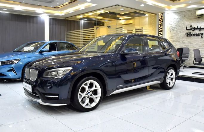 Подержанный BMW X1 18i I (E84) Рестайлинг, 2.0 л, 2015 в Шардже от Honey Jidosha Used Cars Tr. Тёмно-синий цвет. GCC | AUTO.AE | Объявление #273377