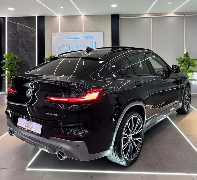 Used BMW X4 M40i II (G02) Facelift, 3.0 l, 2022 in Sharjah by Ayoon Alhoot Motors, Black color. GCC Specs | AUTO.AE