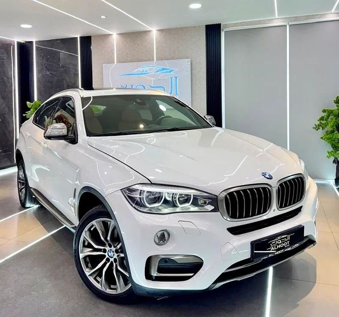 Used BMW X6 50i II (F16), 4.4 l, 2016 in Sharjah by Ayoon Alhoot Motors, White color. GCC Specs | AUTO.AE