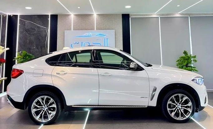 Used BMW X6 50i II (F16), 4.4 l, 2016 in Sharjah by Ayoon Alhoot Motors, White color. GCC Specs | AUTO.AE