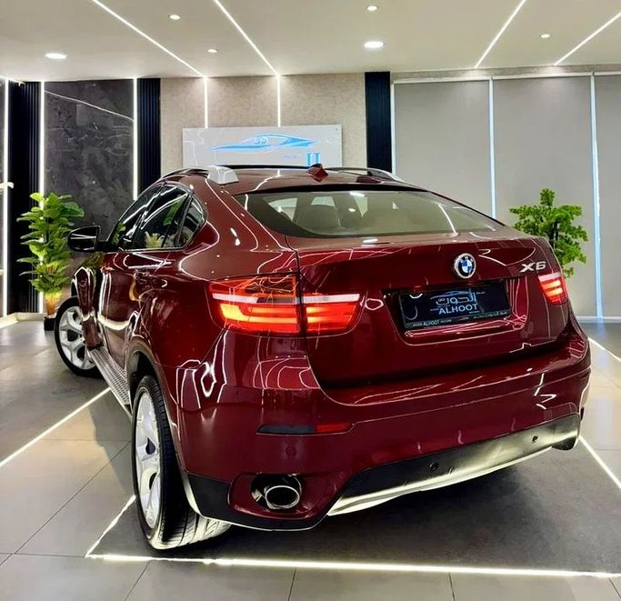 Подержанный BMW X6 35i I (E71), 3.0 л, 2011 в Шардже от Ayoon Alhoot Motors Красный цвет. GCC | AUTO.AE