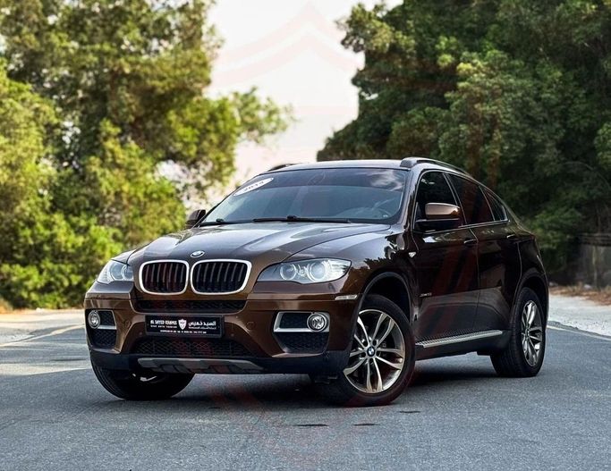 Подержанный BMW X6 35i I (E71) Рестайлинг, 3.0 л, 2014 в Шардже от Al Sayed Khamis Used Auto Trading Коричневый цвет. GCC | AUTO.AE