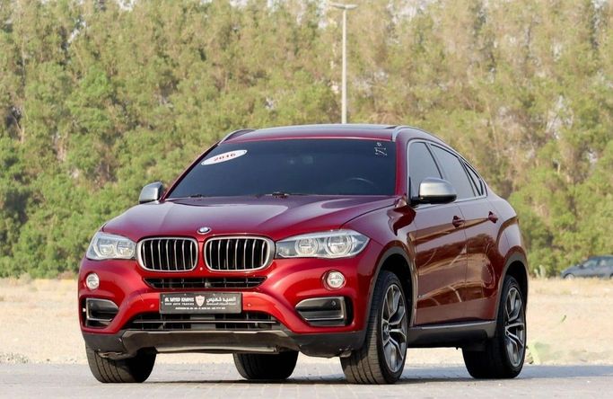 Подержанный BMW X6 50i II (F16), 4.4 л, 2016 в Шардже от Al Sayed Khamis Used Auto Trading Красный цвет. GCC | AUTO.AE