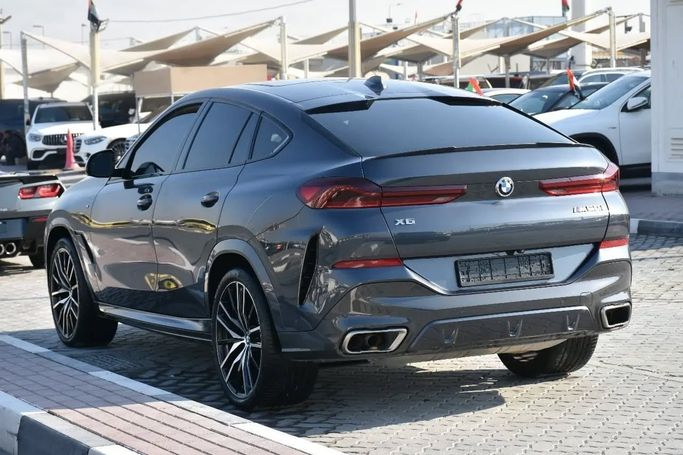 Used BMW X6 M50i III (G06), 4.4 l, 2021 in Sharjah by Alfaris Used Cars, Grey color. Other | AUTO.AE