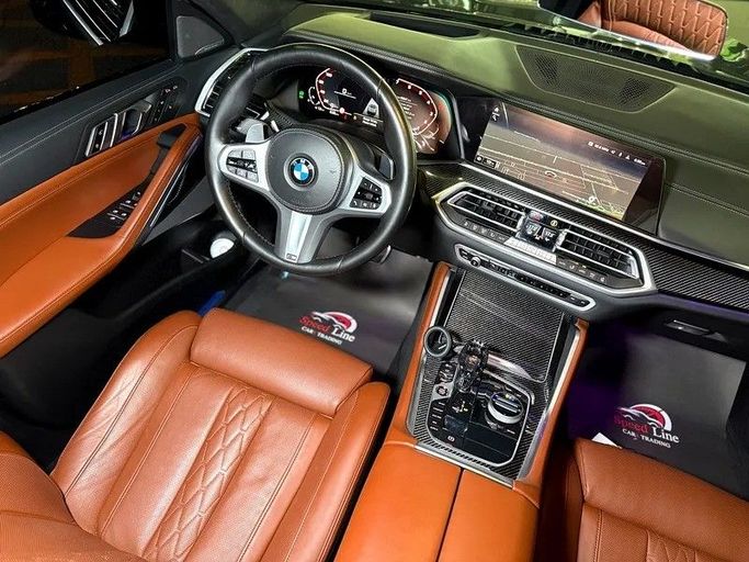 Подержанный BMW X6 M50i III (G06), 4.4 л, 2023 в Шардже от Speed Line Used Cars Синий цвет. GCC | AUTO.AE