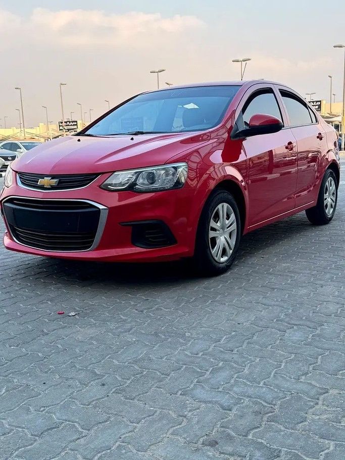 Подержанный Chevrolet Aveo II Рестайлинг, 1.4 л, 2019 в Шардже от Bashar Karoomi Kunani Красный цвет. GCC | AUTO.AE