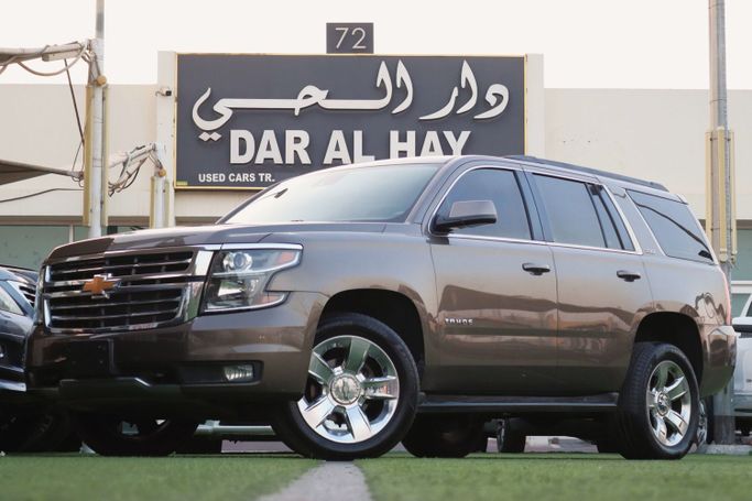 Подержанный Chevrolet Tahoe IV, 5.3 л, 2017 в Шардже от Dar Al Hay Used Cars Коричневый цвет. Other | AUTO.AE
