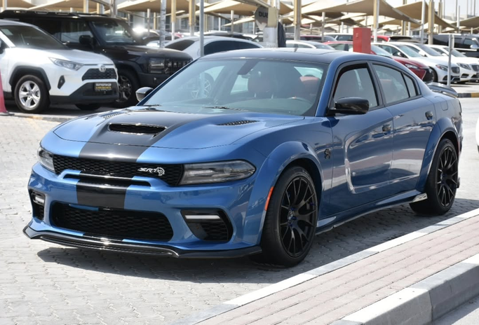 Подержанный Dodge Challenger III Рестайлинг 2, 3.6 л, 2023 в Шардже от Alfaris Used Cars Синий цвет. Other | AUTO.AE