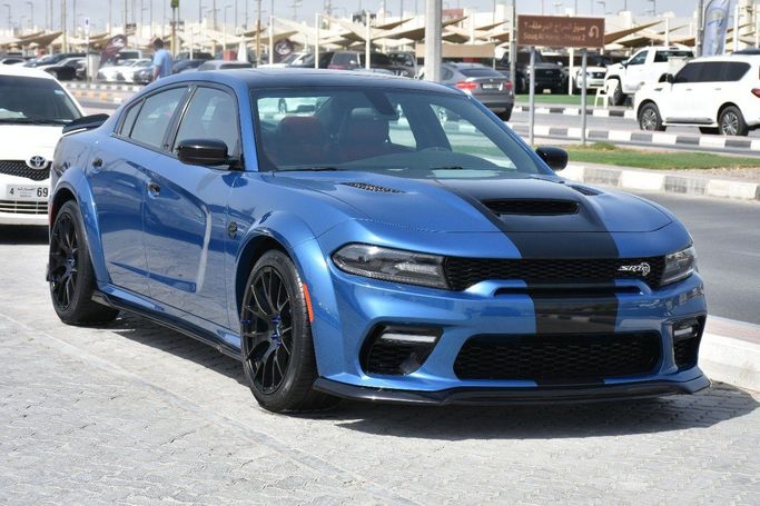 Подержанный Dodge Charger SXT VII (LD) Рестайлинг, 3.6 л, 2023 в Шардже от Alfaris Used Cars Синий цвет.  | AUTO.AE