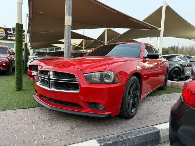 Подержанный Dodge Charger R_T VII (LD), 5.7 л, 2014 в Шардже от Al Muhtaref Used Cars Красный цвет. Американская | AUTO.AE