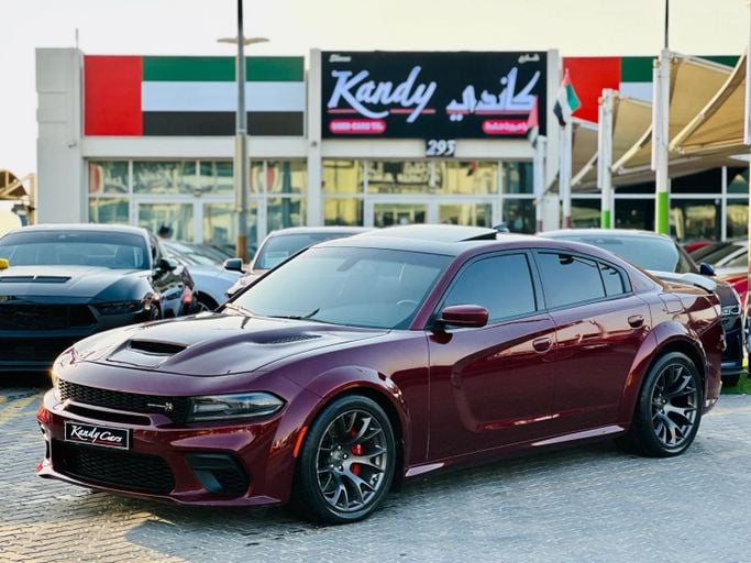 Подержанный Dodge Charger SRT VII (LD) Рестайлинг, 6.4 л, 2020 в Шардже от Kandy Cars Бордовый цвет. Американская | AUTO.AE