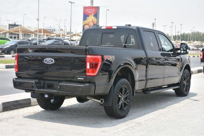 Подержанный Ford F-150 XIV, 3.5 л, 2023 в Шардже от Alfaris Used Cars Черный цвет.  | AUTO.AE