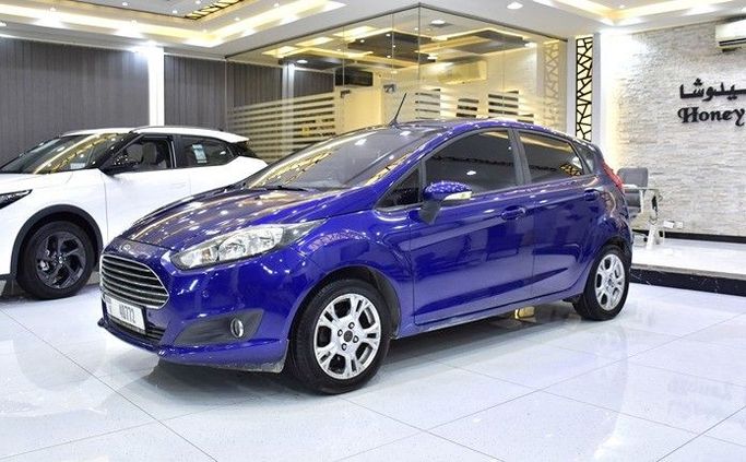 Подержанный Ford Fiesta Mk6 Рестайлинг, 1.6 л, 2015 в Шардже от Honey Gidosha Used Cars Tr. Синий цвет.  | AUTO.AE