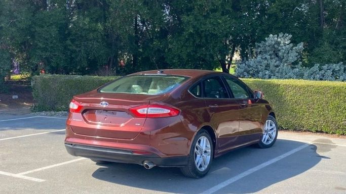 Подержанный Ford Fusion (North America) II, 2.0 л, 2016 в Шардже от Halla Cars Красный цвет. Американская | AUTO.AE