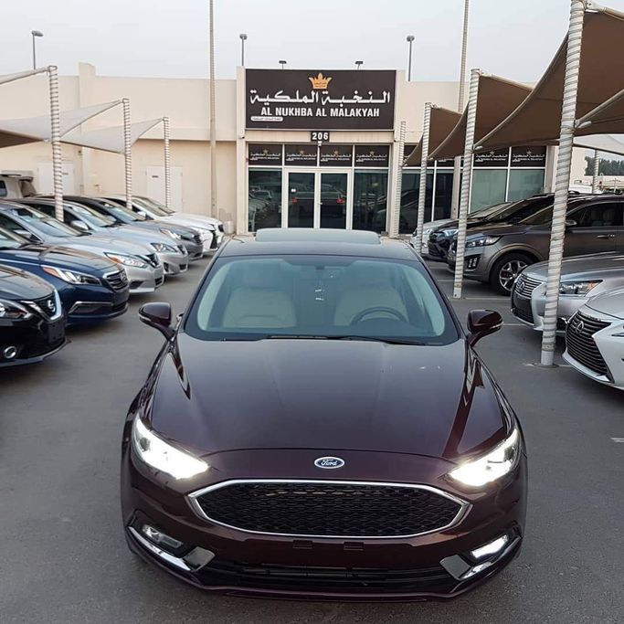 Used Ford Fusion (North America) II Facelift, 2.0 l, 2017 in Sharjah by Al Nukhba Al Malakyah Used Cars, Burgundy color. American Specs | AUTO.AE
