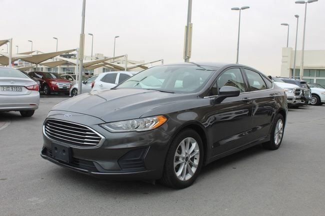 Подержанный Ford Fusion (North America) II Рестайлинг, 2.0 л, 2019 в Шардже от Emirates & Gulf used cars Черный цвет. Американская | AUTO.AE