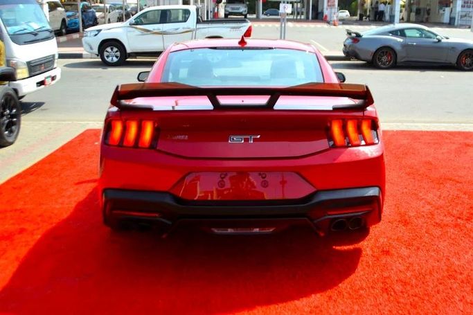 Подержанный Ford Mustang GT VII, 5.0 л, 2024 в Шардже от Wadishee Used Cars Красный цвет. Американская | AUTO.AE