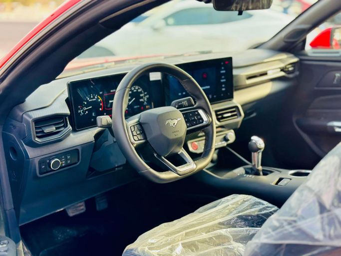 Подержанный Ford Mustang VII, 2.3 л, 2024 в Шардже от Kandy Cars Красный цвет. Other | AUTO.AE
