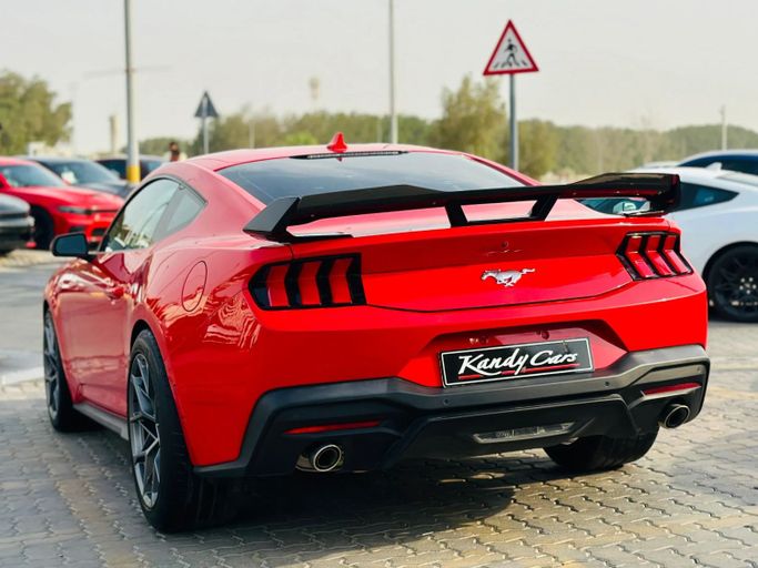 Подержанный Ford Mustang VII, 2.3 л, 2024 в Шардже от Kandy Cars Красный цвет. Other | AUTO.AE
