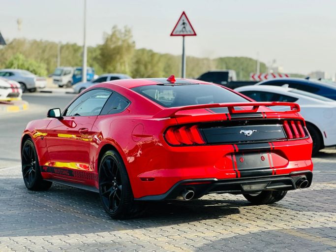 Подержанный Ford Mustang VI Рестайлинг, 2.3 л, 2021 в Шардже от Kandy Cars Красный цвет. Американская | AUTO.AE
