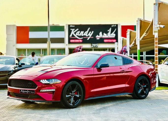 Подержанный Ford Mustang VI Рестайлинг, 2.3 л, 2021 в Шардже от Kandy Cars Красный цвет. Американская | AUTO.AE