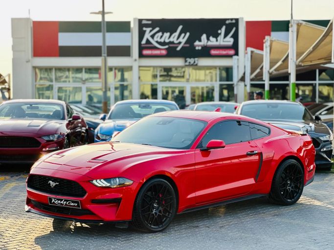 Подержанный Ford Mustang VI Рестайлинг, 2.3 л, 2022 в Шардже от Kandy Cars Красный цвет. Американская | AUTO.AE