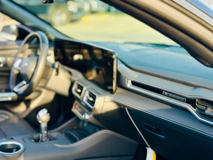 Подержанный Ford Mustang VII, 2.3 л, 2024 в Шардже от Kandy Cars Черный цвет. Американская | AUTO.AE