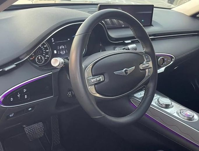 Used Genesis GV70 I, 2.5 l, 2023 in Sharjah by Al Nukhba Al Malakyah Used Cars, Burgundy color. American Specs | AUTO.AE