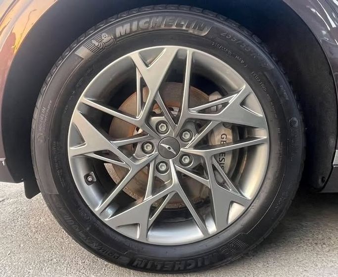 Used Genesis GV70 I, 2.5 l, 2023 in Sharjah by Al Nukhba Al Malakyah Used Cars, Burgundy color. American Specs | AUTO.AE