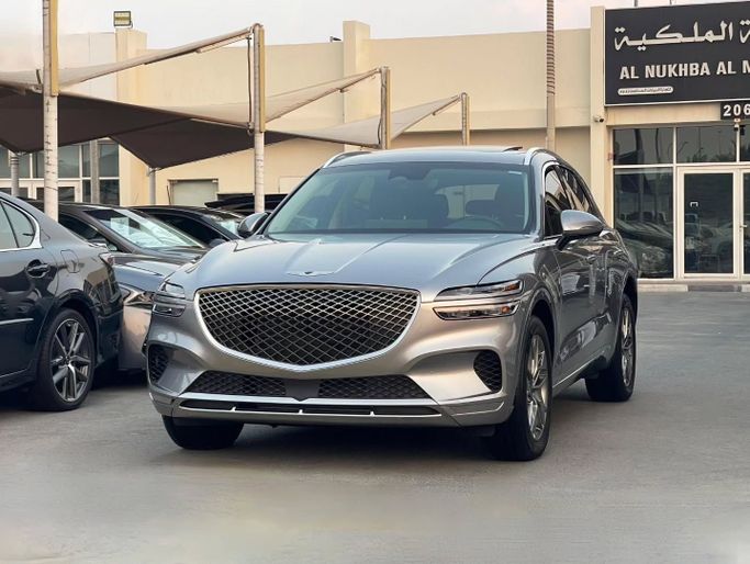 Подержанный Genesis GV70 I Рестайлинг, 2.5 л, 2025 в Шардже от Al Nukhba Al Malakyah Used Cars Серебристый цвет. Американская | AUTO.AE