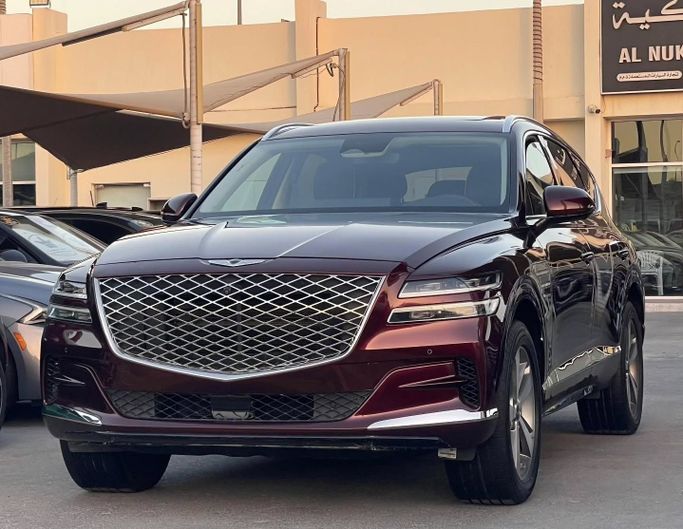 Подержанный Genesis GV80 I, 3.5 л, 2021 в Шардже от Al Nukhba Al Malakyah Used Cars Бордовый цвет. Американская | AUTO.AE