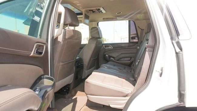 Подержанный GMC Yukon IV (GMT K2UG), 6.2 л, 2018 в Шардже от Alnujoom Al Malakiah Used Cars Белый цвет. GCC | AUTO.AE